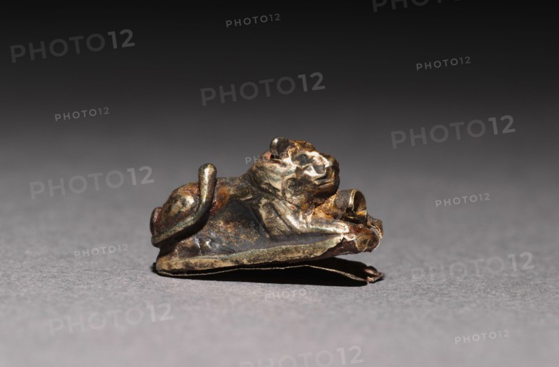 Recumbent Lion Bead, 1980-1801 BC. Egypt, Middle Kingdom, Dynasty 12. Electrum over a clay-bulked resin core; overall: 1 x 0.5 cm (3/8 x 3/16 in.).