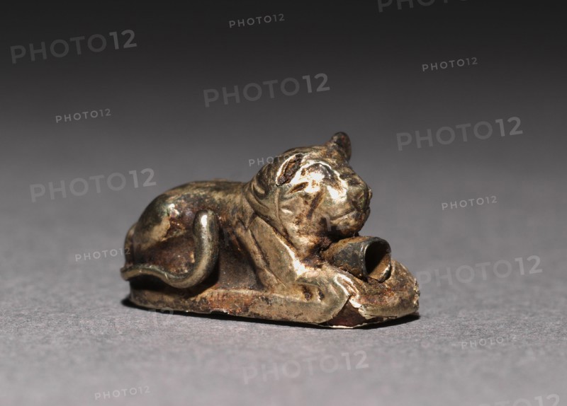 Recumbent Lion Bead, 1980-1801 BC. Egypt, Middle Kingdom, Dynasty 12. Electrum over a clay-bulked resin core; overall: 1 x 0.5 x 1.7 cm (3/8 x 3/16 x 11/16 in.).