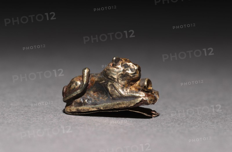 Recumbent Lion Beads, 1980-1801 BC. Egypt, Middle Kingdom, Dynasty 12. Electrum over a clay-bulked resin core; overall: 1 x 0.5 cm (3/8 x 3/16 in.).