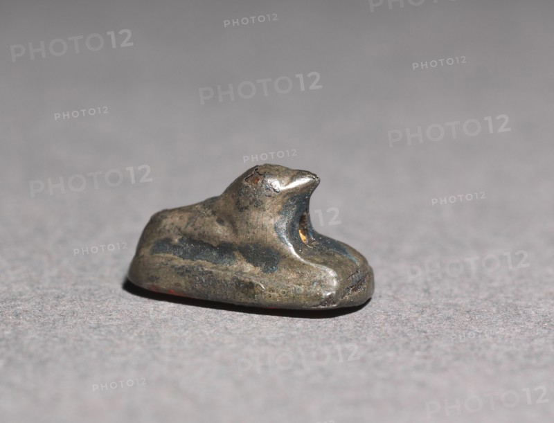 Recumbent Lion Bead, 1980-1801 BC. Egypt, Middle Kingdom, Dynasty 12. Silver foil over a clay-bulked resin core (?); overall: 0.5 x 0.6 cm (3/16 x 1/4 in.).