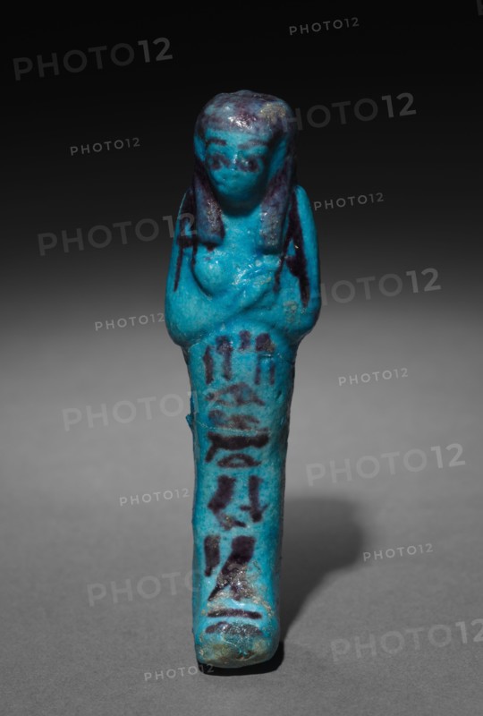 Shawabty of Shedsuhor, 1000-945 BC. Egypt, Third Intermediate Period, Late Dynasty 21 (1069-945 BC). Turquoise faience with dark purle decoration; overall: 10.7 x 4 x 3 cm (4 3/16 x 1 9/16 x 1 3/16 in.).