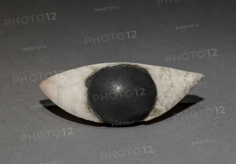 Inlay Eye (one of a pair), 1980-1801 BC. Egypt, El-Haraga, cemetery E, tomb 614, excavated in 1914, Middle Kingdom, Dynasty 12, 1980-1801 BC. Travertine and obsidian; overall: 2.2 cm (7/8 in.).