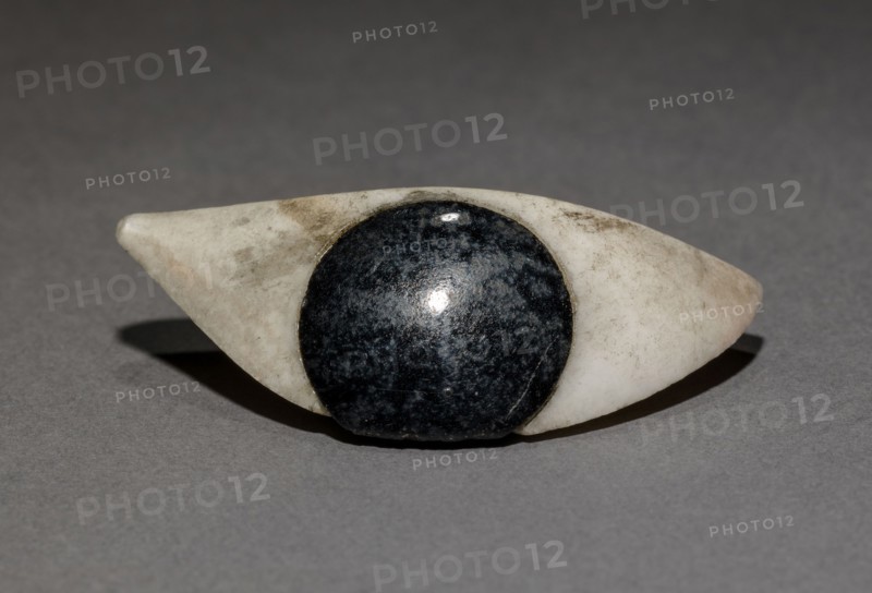 Inlay Eye (one of a pair), 1980-1801 BC. Egypt, El-Haraga, cemetery E, tomb 614, excavated in 1914, Middle Kingdom, Dynasty 12, 1980-1801 BC. Travertine and obsidian; overall: 2 cm (13/16 in.).