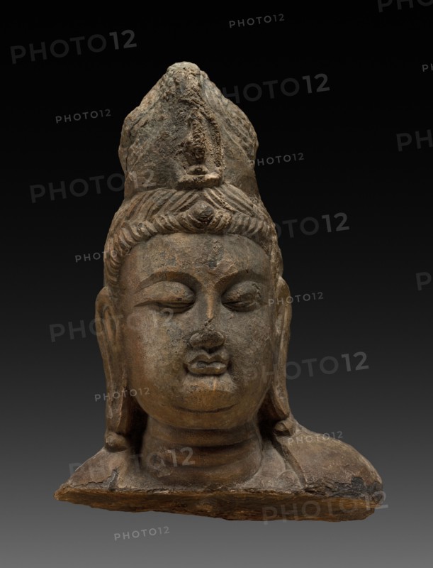 Head of Bodhisattva, 618-907. China, from Lung-mên, Tang dynasty (618-907). Dark gray limestone; overall: 24.9 x 17.2 x 9 cm (9 13/16 x 6 3/4 x 3 9/16 in.).