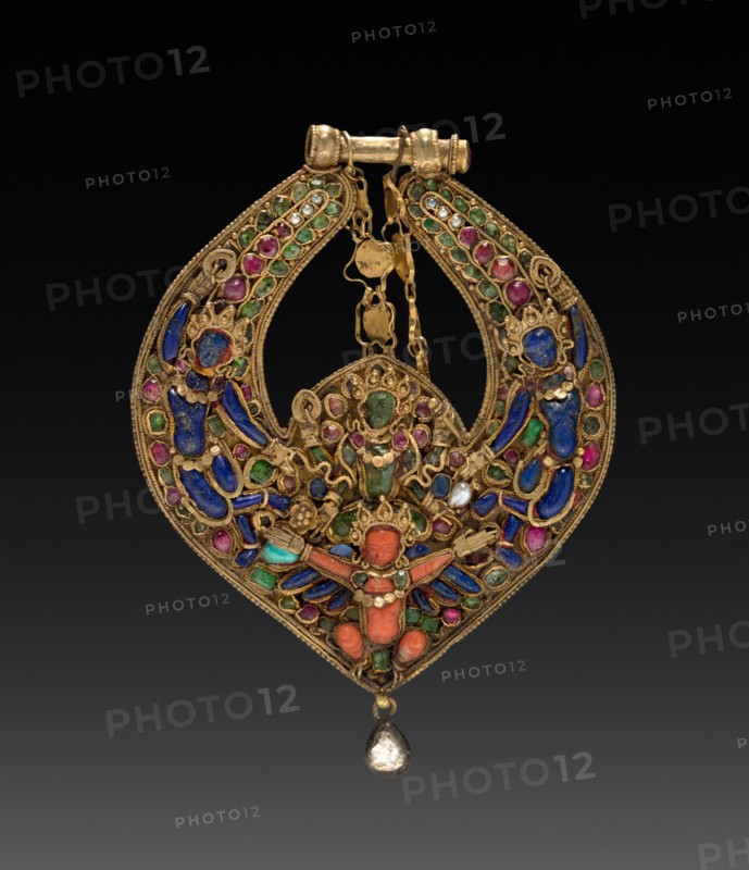 Deity Earring with Vishnu on Garuda (front) and chepu (monster mask) (back), 1600s or 1700s. Nepal, Kathmandu Valley. Gold set with precious and semi-precious stones; 9.5 x 6.9 cm (3 3/4 x 2 11/16 in.).