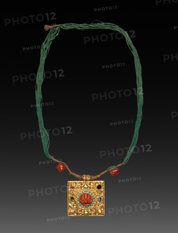 Charm Case, 1800s. Tibet, 19th century. Gold with jewels; overall: 7.2 x 7.8 cm (2 13/16 x 3 1/16 in.); cord: 94 cm (37 in.).