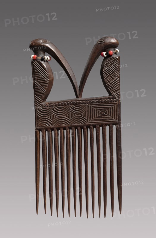 Comb, mid-late 1800s. Central Africa, Angola or Democratic Republic of the Congo, Chokwe peoples, mid-late 19th century. Wood, beads; overall: 13.3 x 8 x 1.4 cm (5 1/4 x 3 1/8 x 9/16 in.)