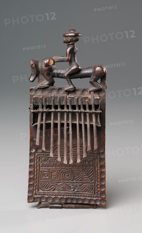 Thumb Piano, late 1800s. Central Africa, Democratic Republic of the Congo or Angola, Chokwe peoples, late 19th century. Wood and iron; overall: 19.1 x 10.2 x 6.4 cm (7 1/2 x 4 x 2 1/2 in.)