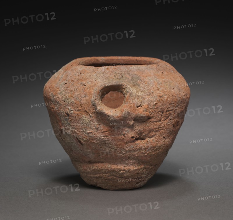 Spouted Jar, 2040-1648 BC. Egypt, Middle Kingdom. Nile silt ware; diameter: 12.7 cm (5 in.); diameter of mouth: 6.8 cm (2 11/16 in.); overall: 10.3 cm (4 1/16 in.).