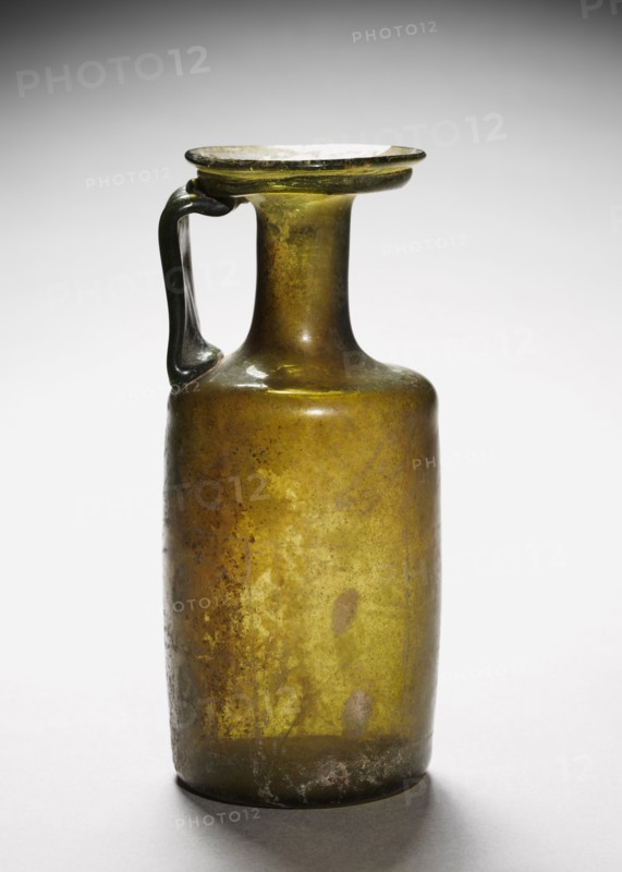 Pitcher, 200-400. Syro-Palestinian, Roman, 3rd - 4th Century. Glass; diameter: 6.5 cm (2 9/16 in.); overall: 18 x 8 cm (7 1/16 x 3 1/8 in.).