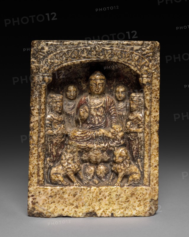 Sakyamuni Preaching: A Votive Stele, c. 565 BC. China, Eastern Zhou dynasty (771-256 BC). Yellow mottled stone; average: 13.7 x 9.9 x 5.3 cm (5 3/8 x 3 7/8 x 2 1/16 in.).