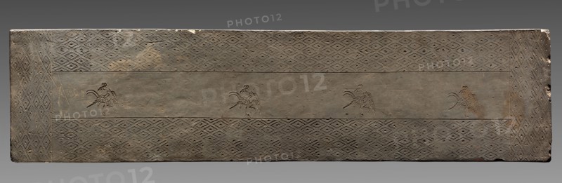 Tomb Tile, Eastern Zhou dynasty (771-256 BC). China, from Chin Ts'un, Hunan province, Eastern Zhou dynasty (771-256 BC). Earthenware with stamped decoration; overall: 175.2 x 43.2 cm (69 x 17 in.).