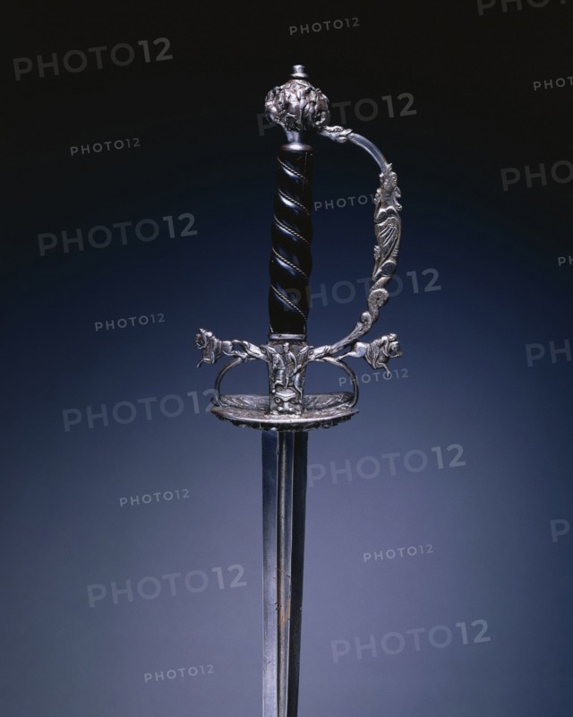 Small Sword, 1640-1660. Germany, Passau (?), 17th century. Steel, wood, steel wire, copper, chiseled shell guard; blade: blued, gilded, pierced and engraved; overall: 104.5 cm (41 1/8 in.); blade: 86 cm (33 7/8 in.); guard: 7.6 cm (3 in.).