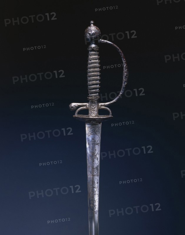 Small Sword, c.1770-1780. France, 18th century. Steel; chiseled relief decoration; blade engraved; wire grip; overall: 97 cm (38 3/16 in.); blade: 79.2 cm (31 3/16 in.); grip: 13.8 cm (5 7/16 in.); guard: 7.6 cm (3 in.).
