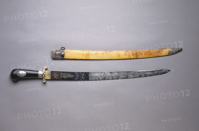 Hunting Sword, c. 1780. France (blade: Germany?), 18th century. Steel, blued, etched, and gilded; silver and wood; overall: 72.1 cm (28 3/8 in.); blade: 56.5 cm (22 1/4 in.); grip: 14 cm (5 1/2 in.); guard: 7.3 cm (2 7/8 in.).