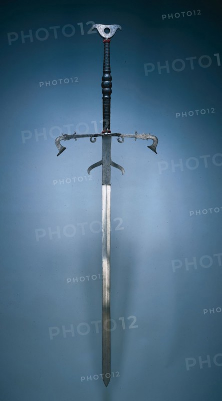Two-Handed Sword of the State Guard of Julius of Brunswick-Lunüneburg, 1574. Germany, Brunswick, 16th century. Steel, leather and wire bound grip; overall: 186.1 cm (73 1/4 in.); blade: 132.1 cm (52 in.); quillions: 51.4 cm (20 1/4 in.); grip: 45.7 cm (18 in.); ricasso: 25.1 cm (9 7/8 in.).
