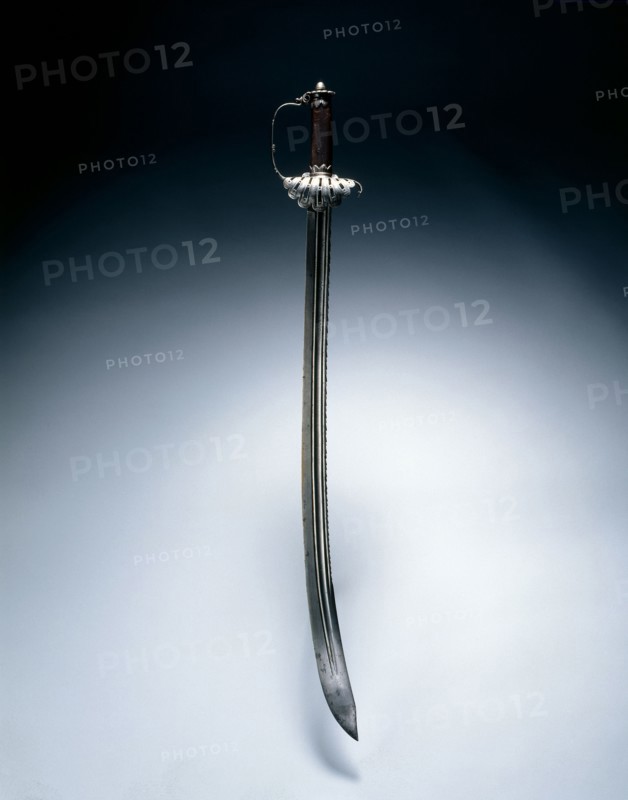 Hunting Sword, c. 1630. Clemens Willems (German). Steel and wood, scroll ornaments; overall: 84.5 cm (33 1/4 in.); blade: 71.2 cm (28 1/16 in.); grip: 12.8 cm (5 1/16 in.); hilt: 11.8 cm (4 5/8 in.).