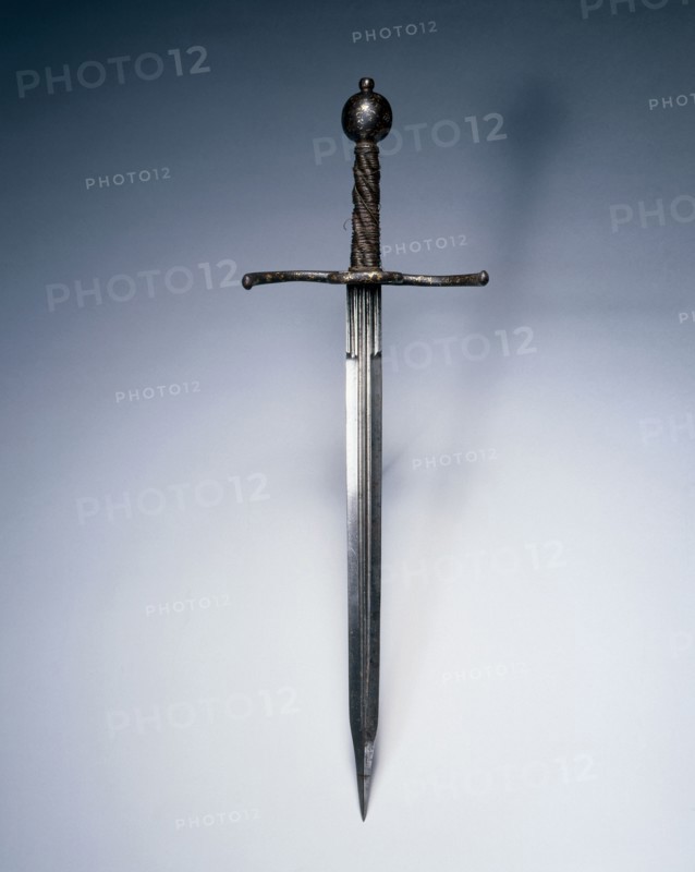 Dagger, c. 1550-1600. Italy, 16th century. Steel; russetted and damascened guard and pommel; wood and wire grip; overall: 50.7 cm (19 15/16 in.); blade: 36.5 cm (14 3/8 in.); quillions: 16.5 cm (6 1/2 in.); grip: 13.3 cm (5 1/4 in.).