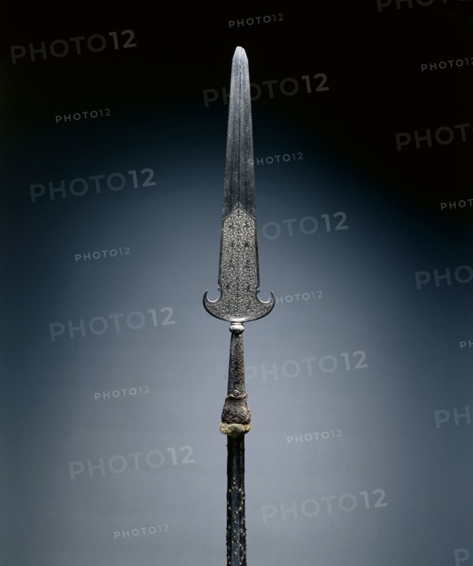 Partisan, c. 1600-1650. France, 17th century. Steel, etched; octagonal wood haft with studs and leather; remnants of velvet tassel; overall: 217.2 cm (85 1/2 in.); blade: 57.2 cm (22 1/2 in.).