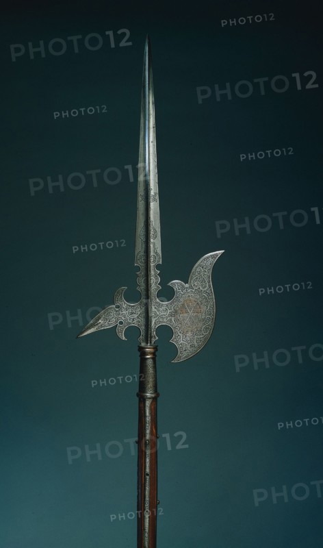 Parade Halberd (from the state guard of Elector Christian I of Saxony [ 1560- 91]), 1586-1591. Germany, Saxony, late 16th Century. Steel, gilt and etched; round wood haft; overall: 238.2 cm (93 3/4 in.); blade: 30.5 cm (12 in.).