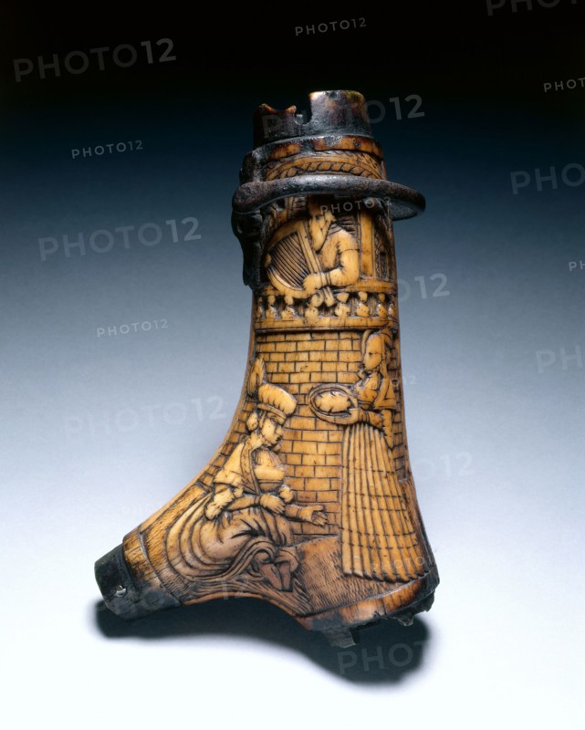 Powder Flask, c. 1580. Germany, late 16th Century. Staghorn (two branches) carved with relief, scene of David and Bathsheba; iron suspension loop; mounts missing; overall: 16.9 x 11.1 cm (6 5/8 x 4 3/8 in.).