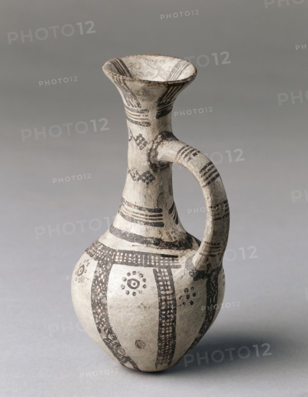 Jug, c. 1450-1200 BC. Cyprus, Late Cypriot II. White slip ware; diameter: 7.1 cm (2 13/16 in.); overall: 14.6 cm (5 3/4 in.); diameter of rim: 4.3 cm (1 11/16 in.).