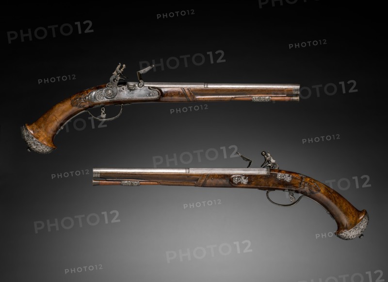 Pair of Flintlock Pistols, c. 1690-1700. Gio Borgognone (Italian), Lazarino Cominazzo (Italian). Steel, chiseled steel with walnut stock; overall: 49.5 cm (19 1/2 in.); barrel: 30.9 cm (12 3/16 in.); bore: 1.3 cm (1/2 in.).