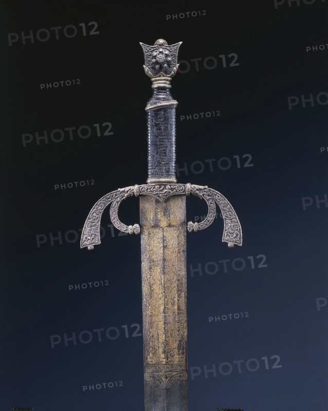 Parade Sword, c. 1500-1525. Italy, Ferrara, early 16th Century. Steel, etched and gilded; overall: 101.9 cm (40 1/8 in.); blade: 85.4 cm (33 5/8 in.); quillions: 17.5 cm (6 7/8 in.); grip: 11.1 cm (4 3/8 in.).