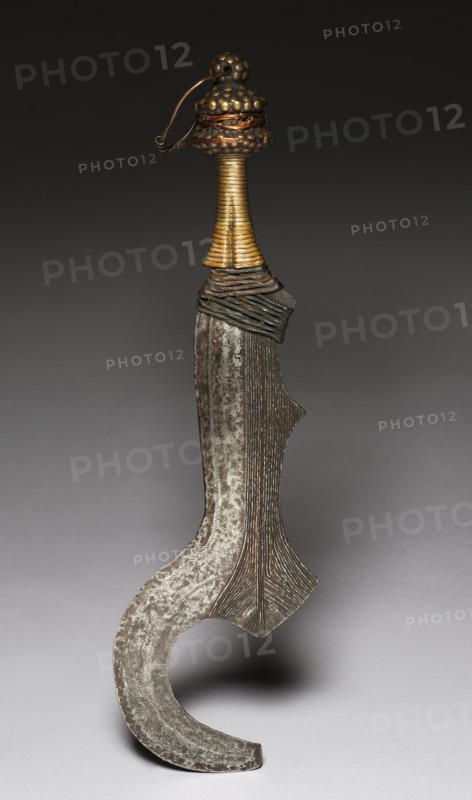 Knife, c. 1900. Central Africa, Democratic Republic of the Congo, Bangala, early 20th Century. Iron, wood, and brass; overall: 57.2 cm (22 1/2 in.); blade: 41.4 cm (16 5/16 in.)