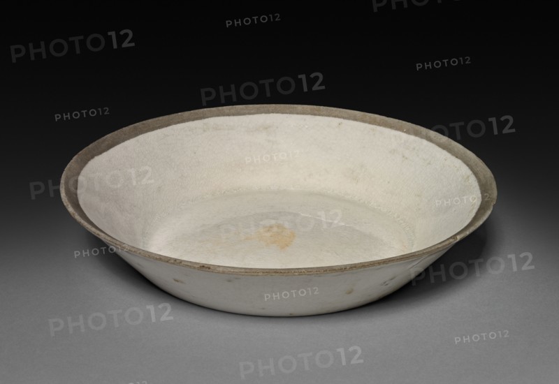 Saucer: Ding ware, 12th-13th Century. China, Jin dynasty (1115-1234) - Yuan dynasty (1271-1368). Porcelain; diameter: 14.6 cm (5 3/4 in.).
