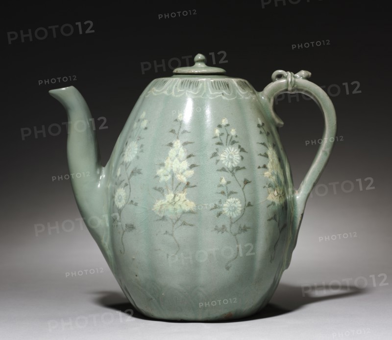 Pitcher with Inlaid Chrysanthemum and Peony Design, 1100s. Korea, Goryeo period (918-1392). Celadon ware with inlaid white and black slip decoration; height with lid: 20.6 cm (8 1/8 in.); outer diameter: 15 cm (5 7/8 in.).