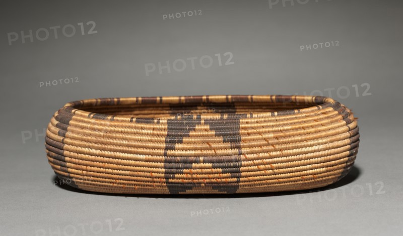 Gift Bowl, Canoe- Shaped, 1890. California, Pomo, late 19th- early 20th century. Willow, Bulrush, Sedge, with feather and acorn woodpecker; coiled (3 rods); overall: 5 x 18 cm (1 15/16 x 7 1/16 in.).