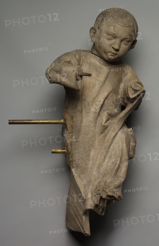 Figure of a Child, 1300s. France, 14th century. Stone; overall: 64.8 x 30.5 cm (25 1/2 x 12 in.)