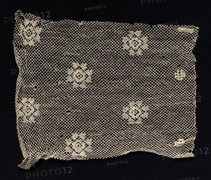 Fragment of a Band with Floral Motif, 18th or early 19th century. Spain, 18th or early 19th century. Needle lace, filet/lacis (knotted ground and darned in one direction); bleached linen (est.); overall: 20 x 23 cm (7 7/8 x 9 1/16 in.).