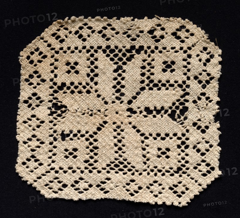 Fragment with Floral Motif, 17th-18th century. Spain, 17th-18th century. Needle lace, filet/lacis (knotted ground and darned in two directions); bleached linen (est.); overall: 14.6 x 15.1 cm (5 3/4 x 5 15/16 in.).