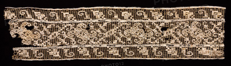 Fragment of a Band with Abstract Pattern, 1500s-1600s. Italy, 16th-17th century. Needle lace, filet/lacis (knotted ground and darned in one and two directions); unbleached and bleached linen (est.); overall: 6.4 x 26.4 cm (2 1/2 x 10 3/8 in.)