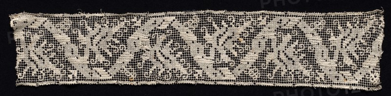 Fragment of a Band with Winding Design and Tendrils, 16th century. Italy, 16th century. Needle lace, filet/lacis (knotted ground and darned in one and two directions); bleached linen (est.); overall: 9.5 x 42.3 cm (3 3/4 x 16 5/8 in.)
