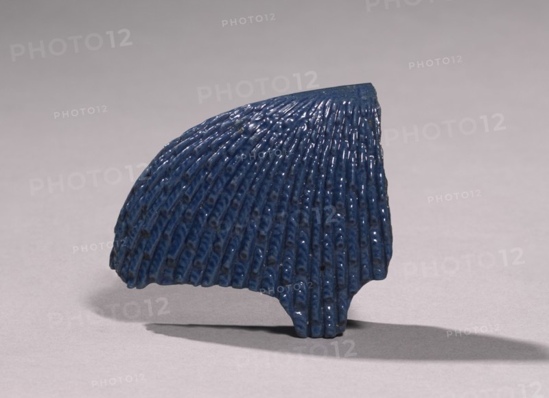 Fragment of an Inlay Headdress, c. 1353-1295 BC. Egypt, New Kingdom, late Dynasty 18 (1540-1296 BC). Lavender blue faience with deep blue overglaze; overall: 6.7 x 7.7 x 2.8 cm (2 5/8 x 3 1/16 x 1 1/8 in.).