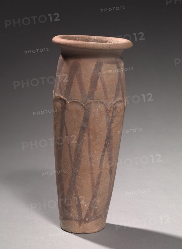 Wavy-Lined Jar, 4000-3000 BC. Egypt, late Predynastic Period, Naqada IIIa2 (Dynasty 0). Marl clay pottery; diameter: 10.1 cm (4 in.); diameter of mouth: 7.5 cm (2 15/16 in.); overall: 26.8 cm (10 9/16 in.).