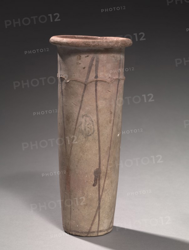 Wavy-Handled Jar, 4000-3000 BC. Egypt, Predynastic Period, Naqada IIa2 period (Dynasty 0) or later. Marl clay ware; diameter: 10.9 cm (4 5/16 in.); diameter of mouth: 8.8 cm (3 7/16 in.); overall: 28.7 cm (11 5/16 in.).
