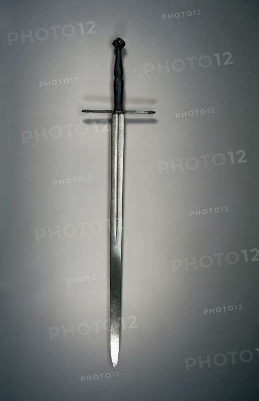 Hand-and-a-Half Sword, c. 1500. South Germany, early 16th Century. Steel, wood, leather; quillions and spirally fluted pommel of blackened steel; overall: 117.5 cm (46 1/4 in.); blade: 90.2 cm (35 1/2 in.); quillions: 26.4 cm (10 3/8 in.); grip: 21 cm (8 1/4 in.).