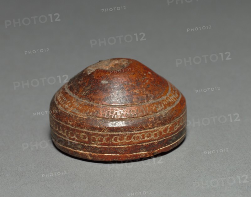 Spinning Whorl, before 1550. Colombia. Red ware; diameter: 4.8 cm (1 7/8 in.); overall: 2.6 cm (1 in.).
