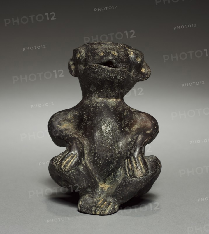 Seated Figure, before 1921. Colombia. Pottery; overall: 14 x 10.2 cm (5 1/2 x 4 in.).