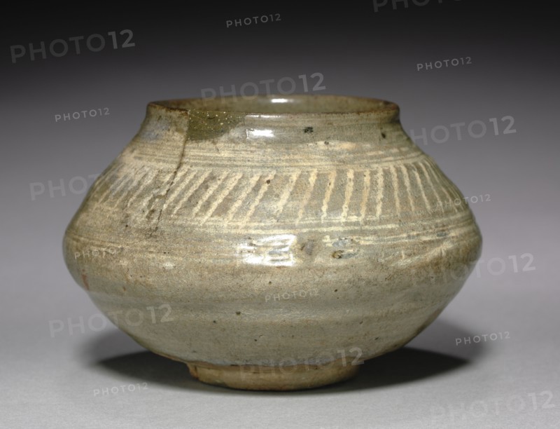 Bowl with Stamped Decoration, 1400s. Korea, early Joseon dynasty (1392-1910). Stoneware with incised design, white slip, and overglaze; outer diameter: 14 cm (5 1/2 in.); overall: 9.1 cm (3 9/16 in.).