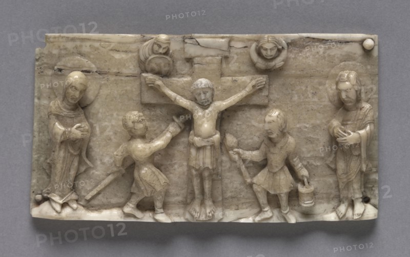 Plaque from a Portable Altar Showing the Crucifixion, 1050-1100. Germany, Lower Rhine Valley, Romanesque period, 11th century. Walrus ivory; overall: 5.1 x 9.6 cm (2 x 3 3/4 in.).
