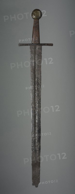 Sword, c. 1350. Germany (?), 14th century. Iron; wood grip and brass pommel replacements; overall: 79.4 cm (31 1/4 in.); blade: 62.9 cm (24 3/4 in.); quillions: 15.3 cm (6 in.); grip: 10.8 cm (4 1/4 in.).