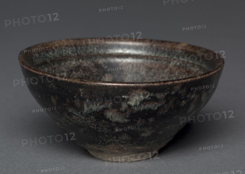 Tea Bowl:  Jizhou Ware, 1127-1279. China, Jiangxi province, Southern Song dynasty (1127-1279). Buff stoneware with iron brown glazeand paper-cut decoration; diameter: 12.1 cm (4 3/4 in.); overall: 6 cm (2 3/8 in.).