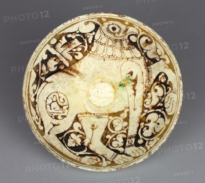 Bowl with Griffin, 1100s. Northwest Iran, Garrus district, Seljuk period, 12th century. Earthenware with underglaze slip-painted decoration; overall: 6.6 x 16.7 cm (2 5/8 x 6 9/16 in.).