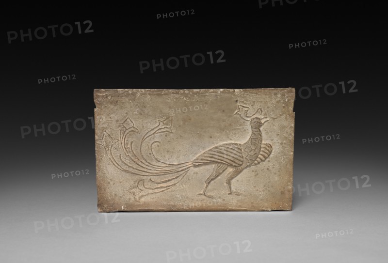 Panel from Model Cooking Stove:  Bird and Phoenix, 1st Century BC. China, from a tomb in Sian-fu, Shensi province, Western Han dynasty (202 BC-AD 9). Earthenware with impressed relief decoration; overall: 12.1 x 18.4 cm (4 3/4 x 7 1/4 in.).