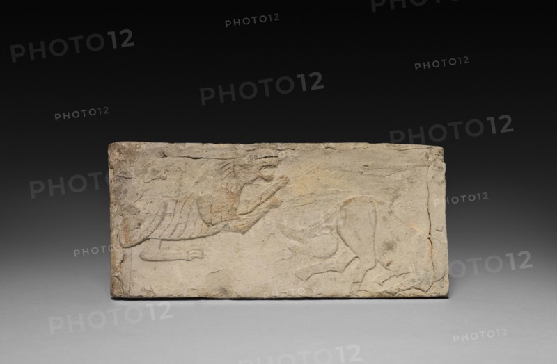 Relief with Rampant Tiger and Boar from a Funerary Stove Model, 206 BC- AD 220. China, from a tomb in Sian-fu, Shensi province, Han dynasty (202 BC-AD 220). Earthenware with relief decoration; overall: 10.2 x 9.6 cm (4 x 3 3/4 in.).
